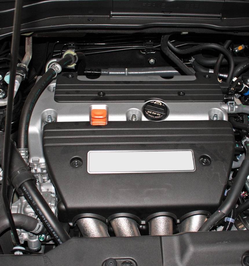 A close up of the engine compartment of a car.